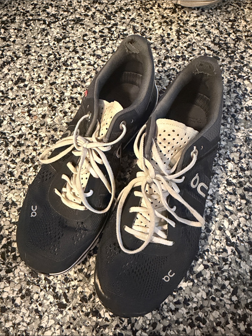 On Running womens Sneakers in Black and White with Cream Laces